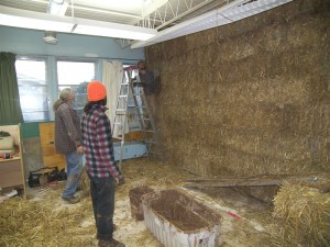 Building a straw bale wall, which will be covered with earth plaster