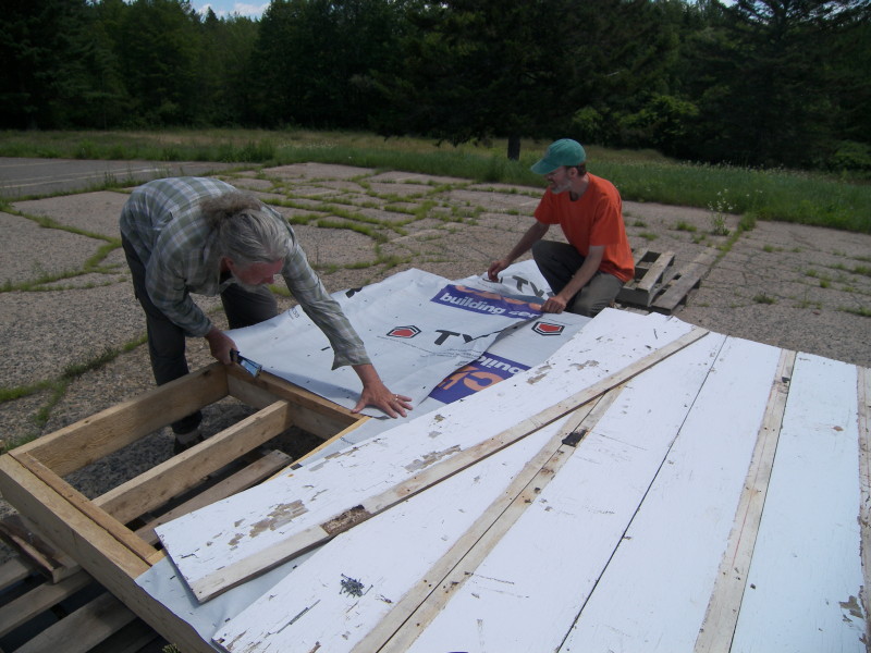 The belly of the beast: adding Tyvek and plywood to the underside to hold the insulation.
