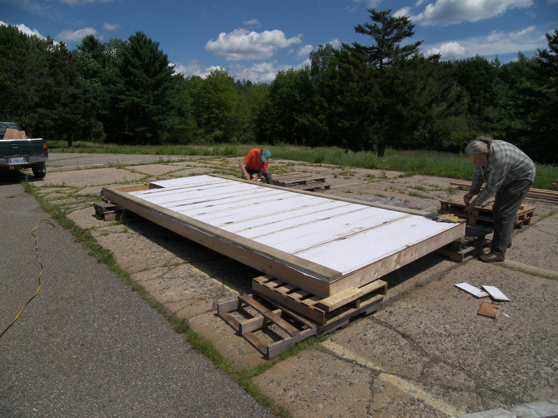 Skids have been nailed on and the floor is ready to flip back right-side-up.