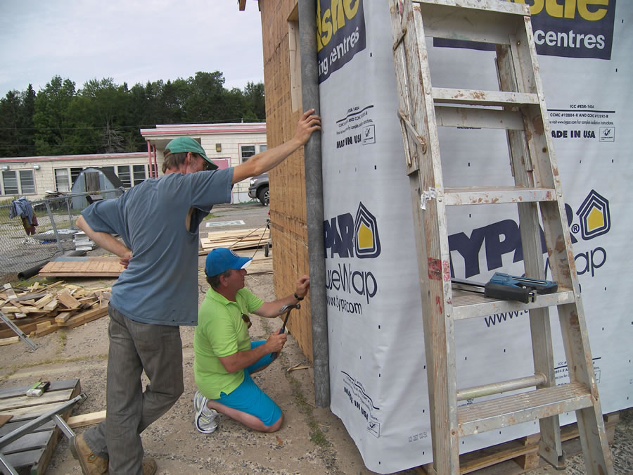John helping with the housewrap.