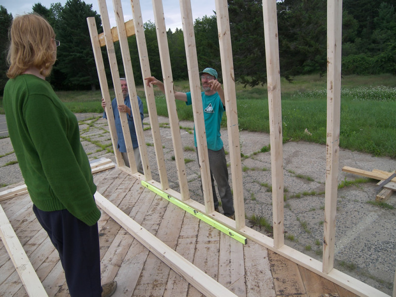 Lloyd points out where the windows will go. Lots of windows.