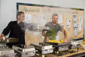 Chefs Matthew Krizan and Peter Hardy serve up local deliciousness in the gym at our IncrEdible Picnic, Sept. 2013. B. Schuler photo.